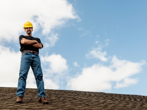 A skilled roofer inspecting and repairing a damaged roof in Mount Juliet.