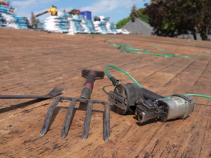 Roof shingle repair by a Green Hill roofing contractor in autumn