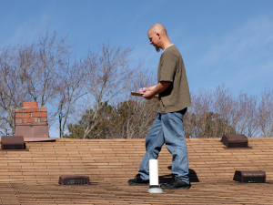 Cottontown homeowner evaluating their roof for a potential DIY replacement project vs calling professional roofers.