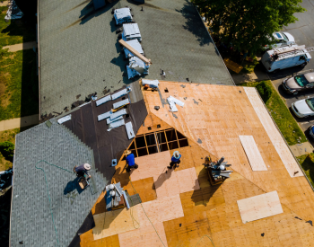 Roof replacement in progress during summer in Green Hill